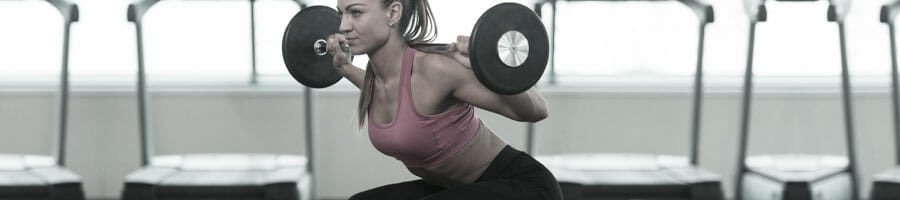 woman doing a barbell squat