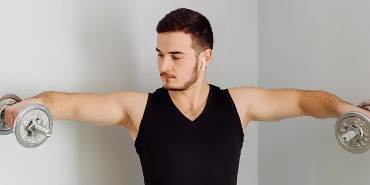 Holding two dumbbell for arm workout
