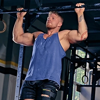 A strong man doing pull ups
