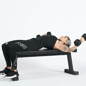 Woman doing a flat dumbbell fly