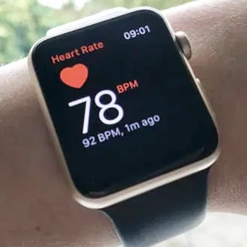 A close up shot of a fitness tracker watch displaying heart rate