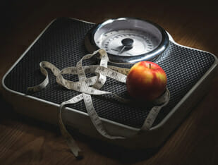 Scale with an apple on it