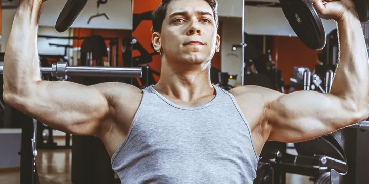A person with large muscles doing upper body HIIT