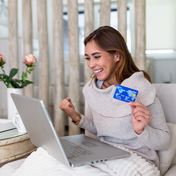 woman on her laptop and credit card